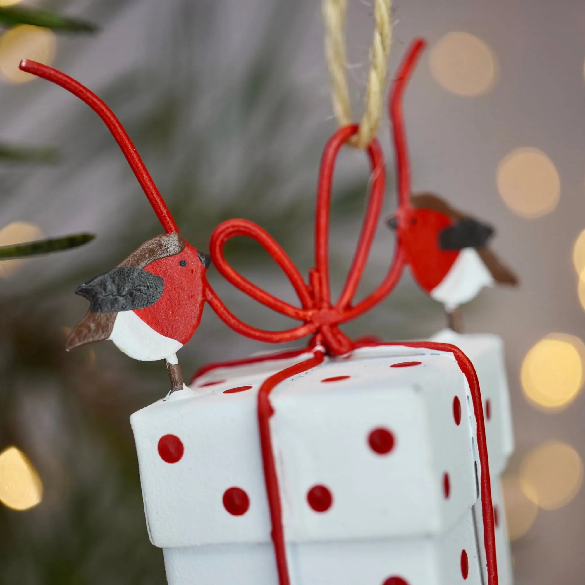 Robins Tying White Christmas Parcel