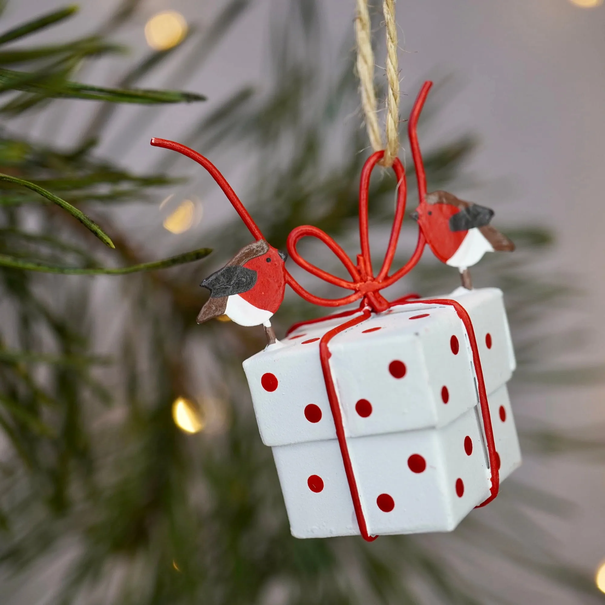 Robins Tying White Christmas Parcel