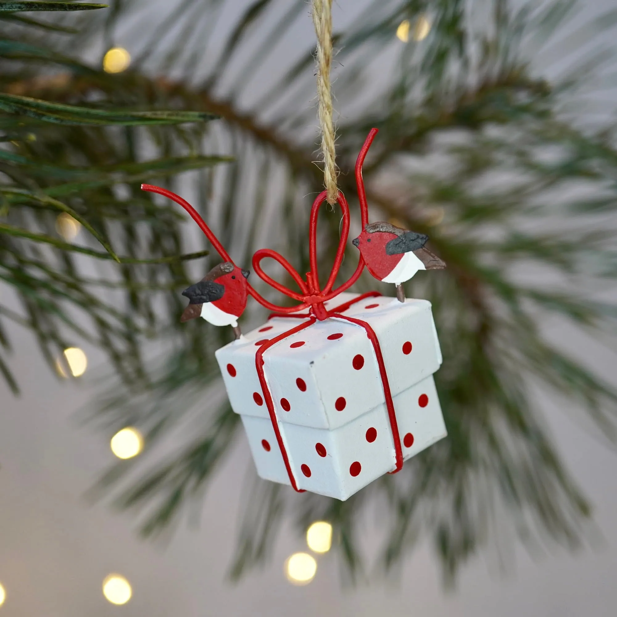 Robins Tying White Christmas Parcel