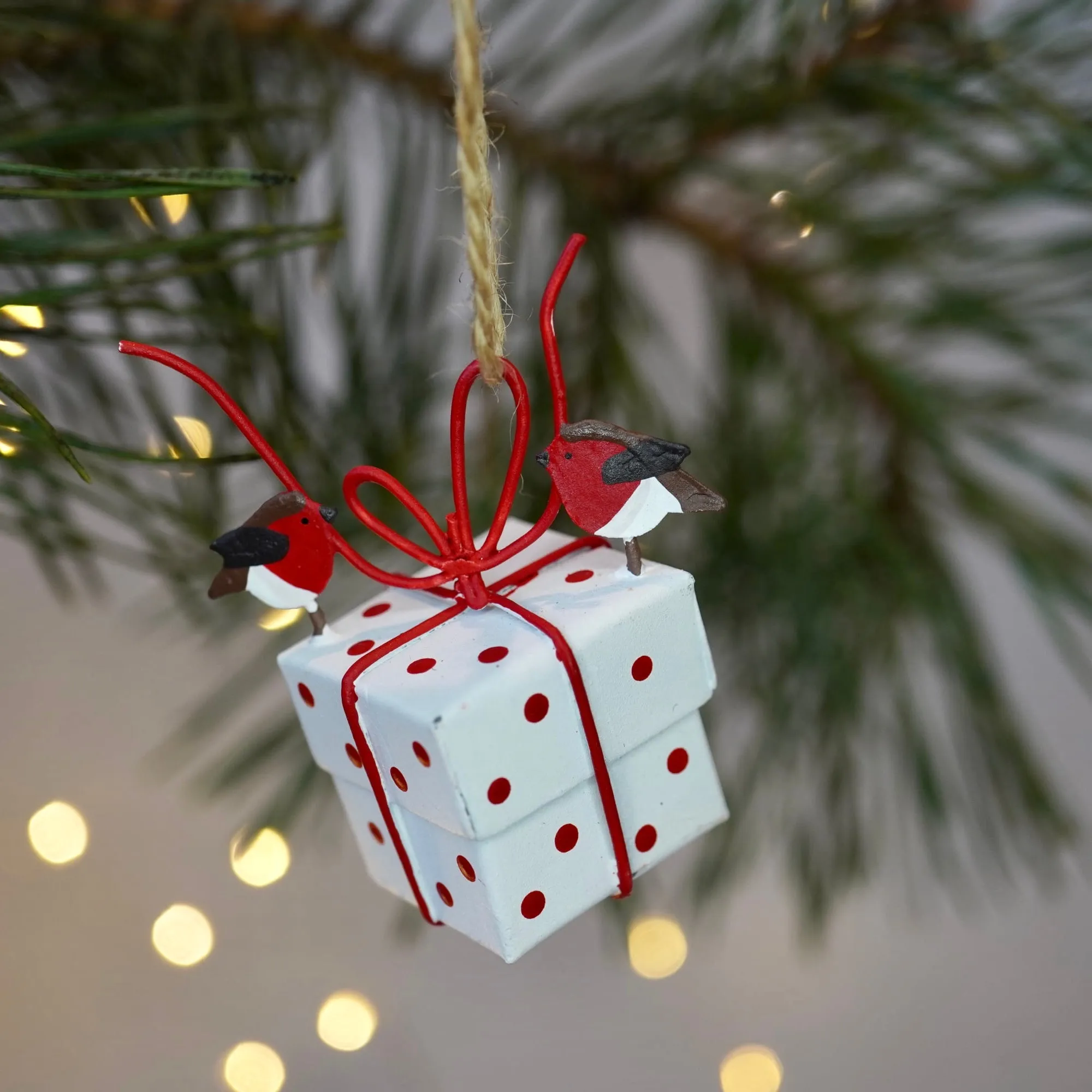 Robins Tying White Christmas Parcel